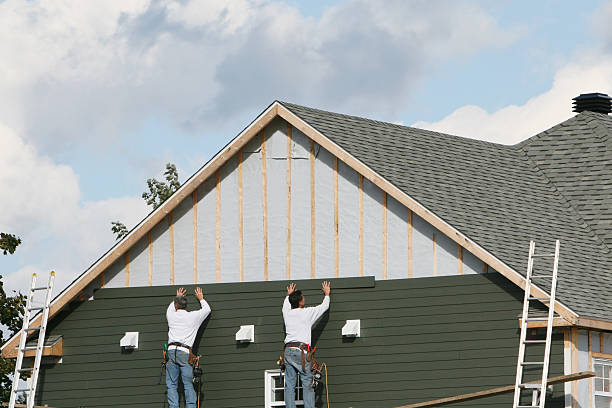 Professional Storm Damage Siding Repair technician working in White Plains, VA
